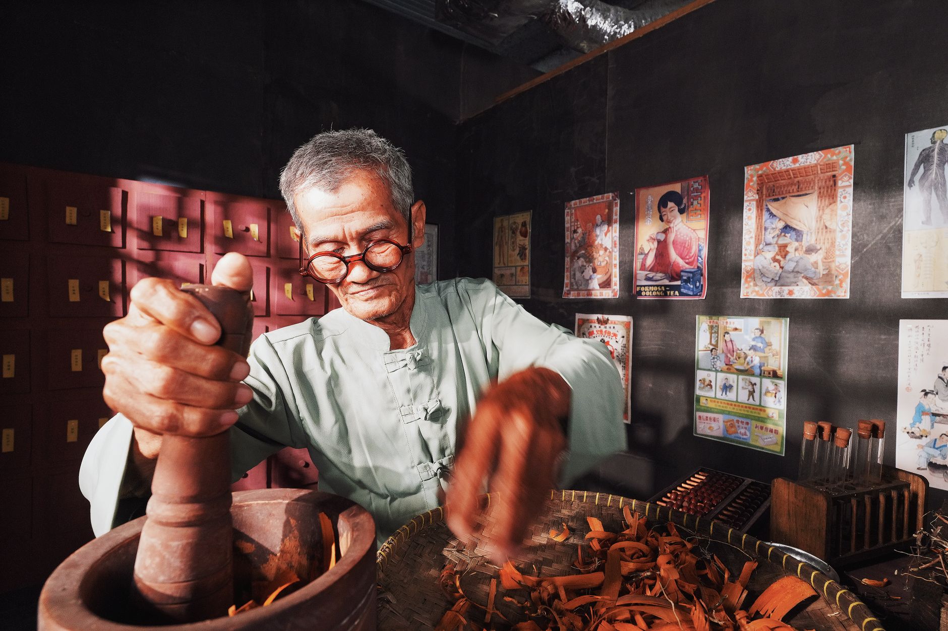 Traditional Chinese Medicine – dried herbs and a stone mortar for grinding.