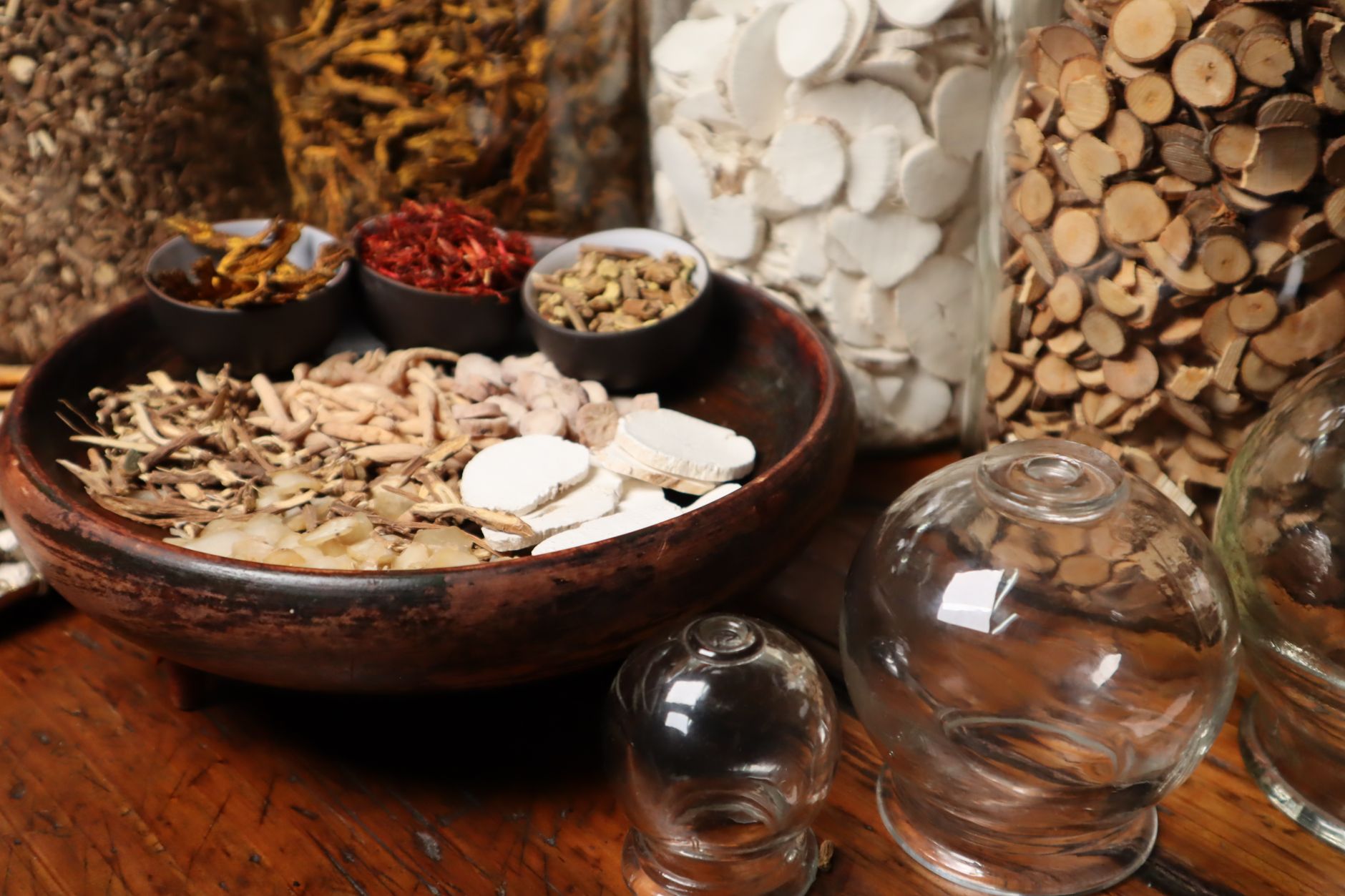What is Qi – Traditional Chinese herbs alongside glowing energy pathways.