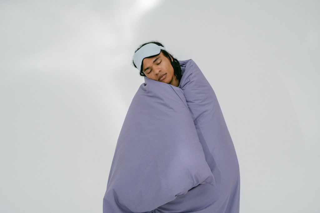 cover stomach while sleeping – person asleep with blanket over midsection