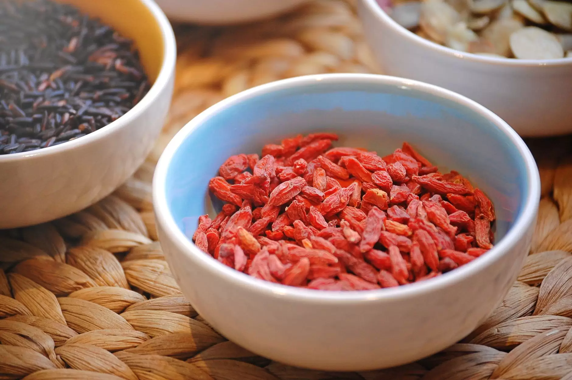 goji berries Chinese – dried red berries in a wooden bowl